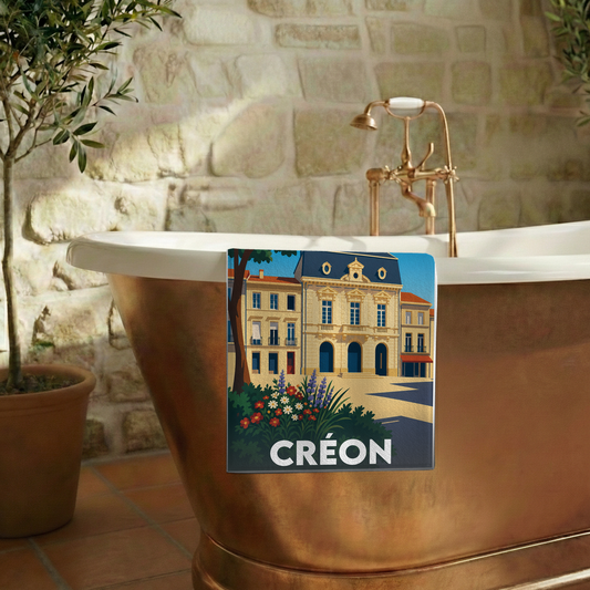 Serviette de bain souvenir de la ville de Créon avec une illustration stylisée.