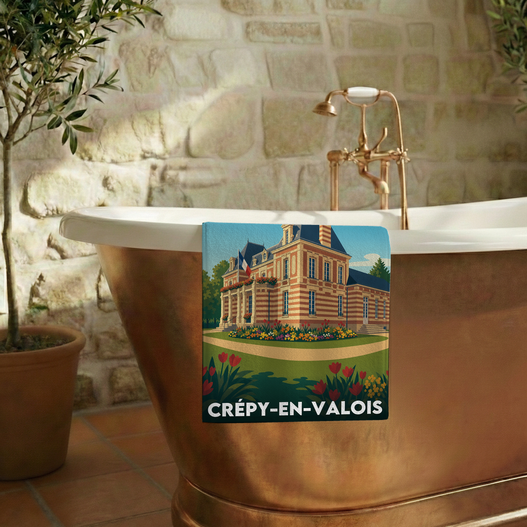 Serviette de bain souvenir de la ville de Crépy-en-Valois avec une illustration stylisée.