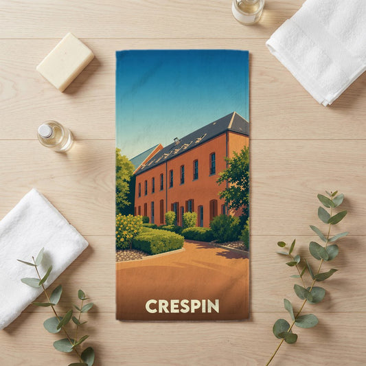 Serviette de bain souvenir de la ville de Crespin avec une illustration stylisée d'un bâtiment en briques.