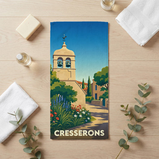 Serviette de bain souvenir de la ville de Cresserons avec une illustration stylisée de son église.