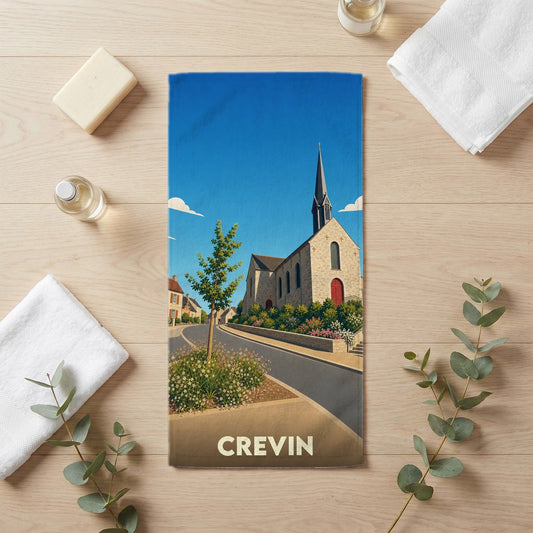 Serviette de bain souvenir de la ville de Crevin avec une illustration stylisée d'une église et de fleurs.