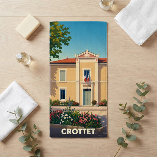 Serviette de bain souvenir de la ville de Crottet avec une illustration stylisée d'un bâtiment officiel.