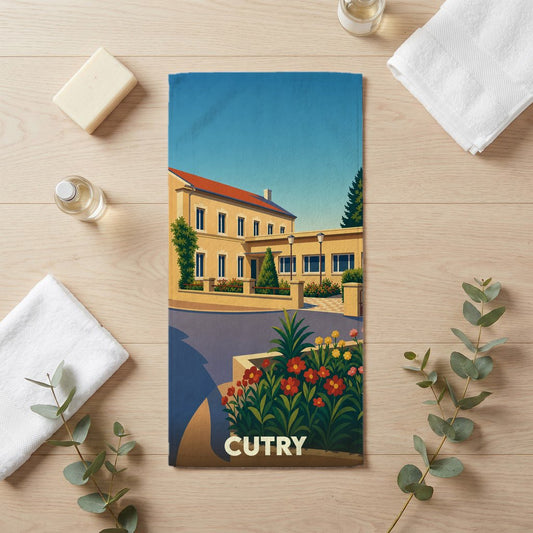Serviette de bain souvenir de la ville de Cutry avec une illustration stylisée d'un bâtiment et de fleurs.