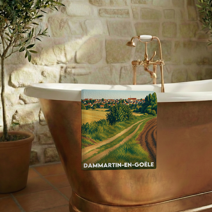 Serviette de bain souvenir de la ville de Dammartin-en-Goële avec une illustration stylisée de son paysage.