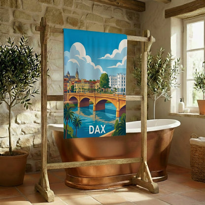 Serviette de bain souvenir de la ville de Dax avec une illustration stylisée de son pont et de ses rives.
