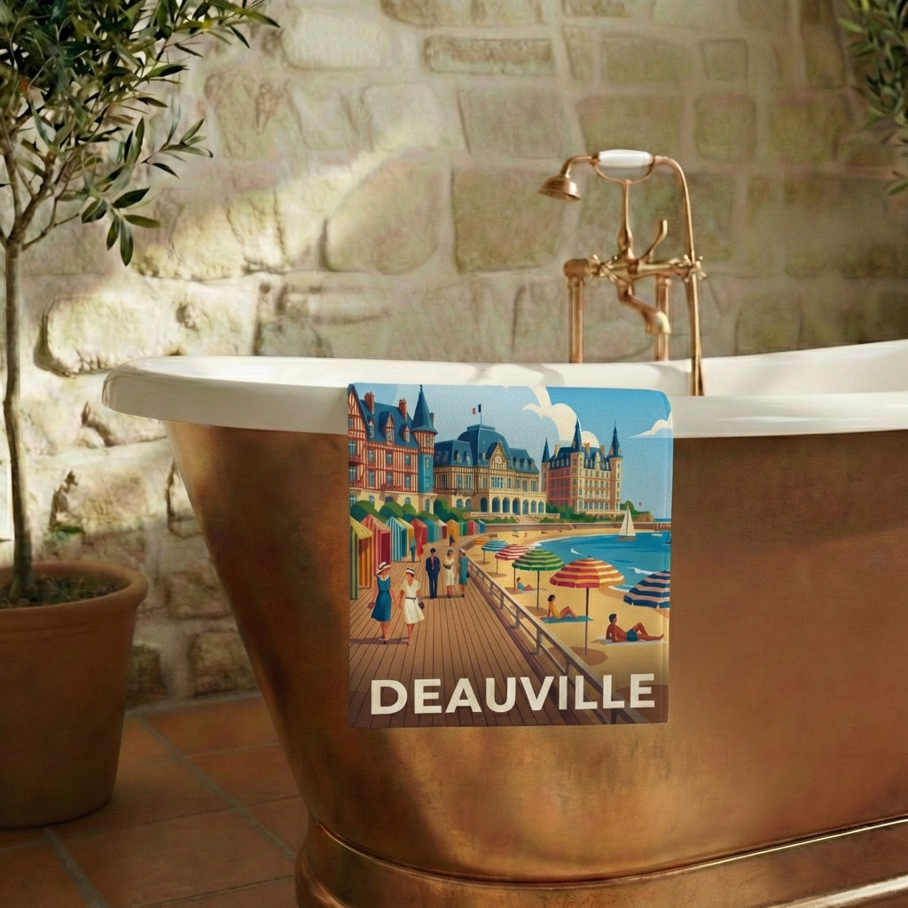Serviette de bain souvenir de la ville de Deauville avec une illustration stylisée de sa célèbre plage.