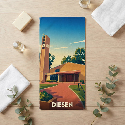 Serviette de bain souvenir de la ville de Diesen avec une illustration stylisée de son église.