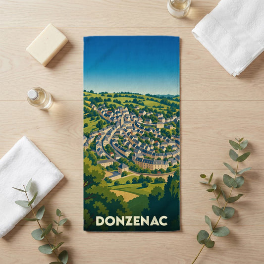 Serviette de bain souvenir de la ville de Donzenac avec une illustration stylisée.