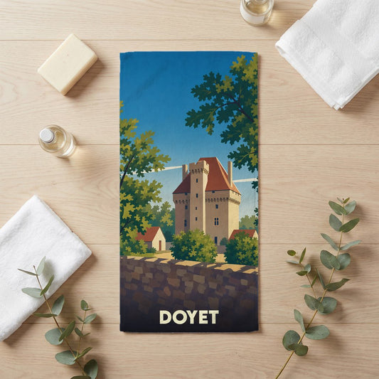 Serviette de bain souvenir de la ville de Doyet avec une illustration stylisée d'un château.