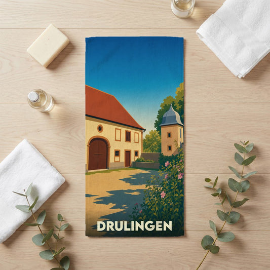Serviette de bain souvenir de la ville de Drulingen avec une illustration stylisée.