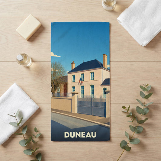 Serviette de bain souvenir de la ville de Duneau avec une illustration stylisée d'un bâtiment officiel.