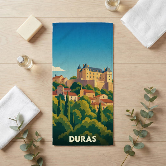 Serviette de bain souvenir de la ville de Duras avec une illustration stylisée de son château.