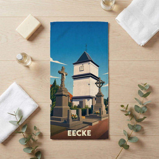 Serviette de bain souvenir de la ville d'Eecke illustrant son clocher et son cimetière dans un style vintage.