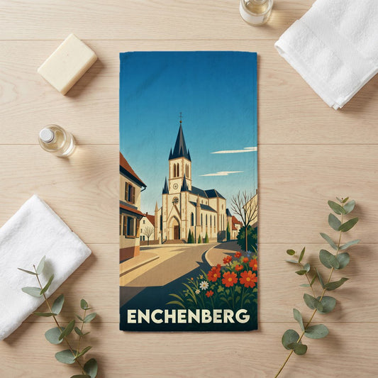 Serviette de bain souvenir de la ville d'Enchenberg avec une illustration stylisée de son église et ses fleurs.