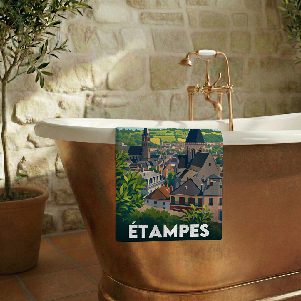 Serviette de bain souvenir de la ville d'Étampes avec une illustration stylisée de ses toits et clochers.