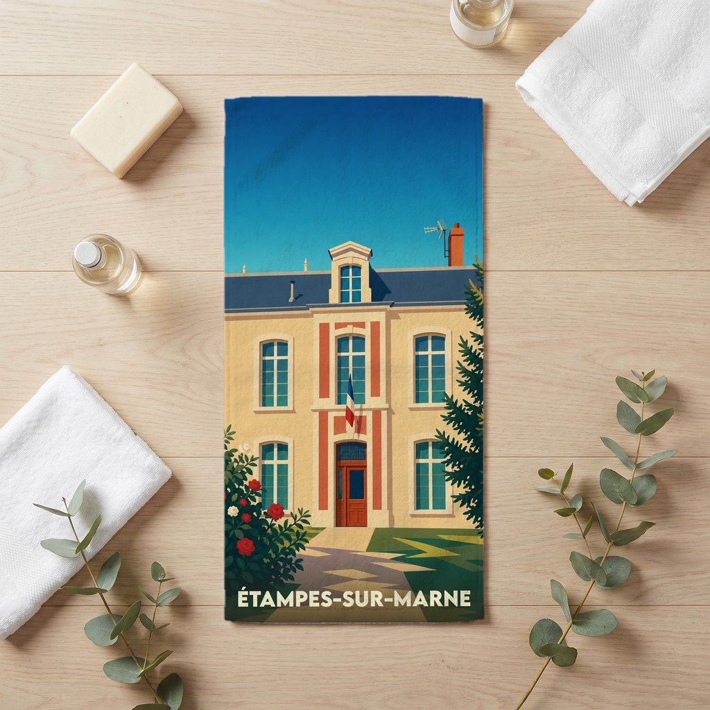 Serviette de bain souvenir de la ville de Étampes-sur-Marne avec une illustration stylisée d'un bâtiment classique.