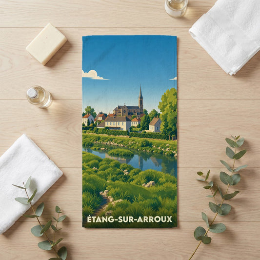Serviette de bain souvenir de la ville de Étang-sur-Arroux avec une illustration stylisée d'un paysage fluvial.