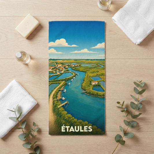 Serviette de bain souvenir de la ville d'Étaules avec une illustration stylisée d'un paysage de marais.