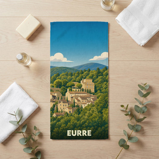 Serviette de bain souvenir de la ville d'Eurre avec une illustration stylisée de son village perché.