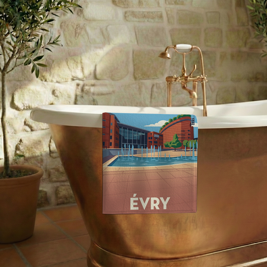 Serviette de bain souvenir de la ville d'Évry avec une illustration stylisée.