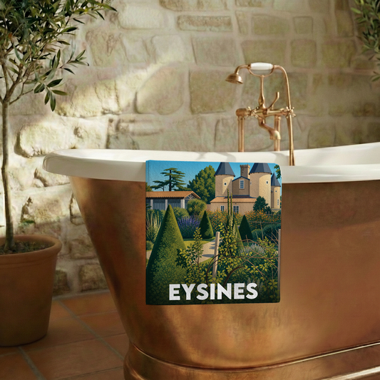 Serviette de bain souvenir de la ville d'Eysines avec une illustration stylisée d'un jardin et d'un château.