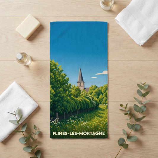 Serviette de bain souvenir de la ville de Flines-lès-Mortagne avec une illustration de son église et de paysages verdoyants.