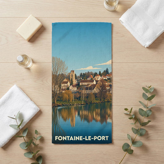 Serviette de bain souvenir de la ville de Fontaine-le-Port avec une illustration stylisée des bords de Seine.