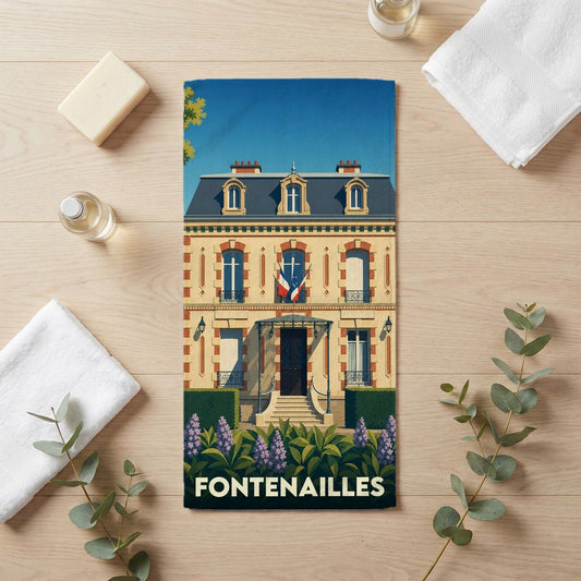 Serviette de bain souvenir de la ville de Fontenailles illustrée d'une bâtisse de style français.