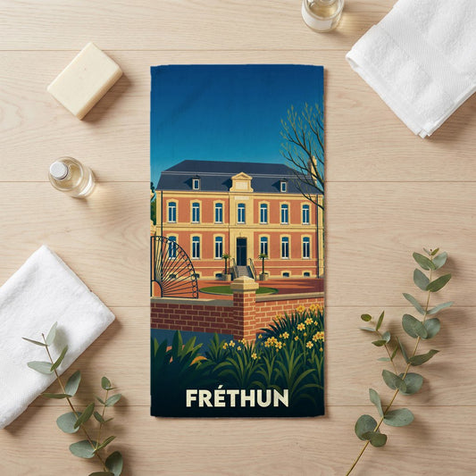 Serviette de bain souvenir de la ville de Fréthun avec une illustration stylisée.
