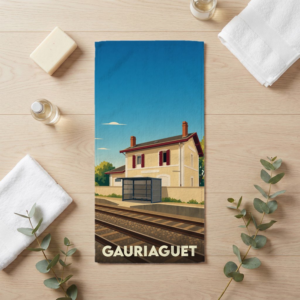 Serviette de bain souvenir de la ville de Gauriaguet avec une illustration stylisée de sa gare.