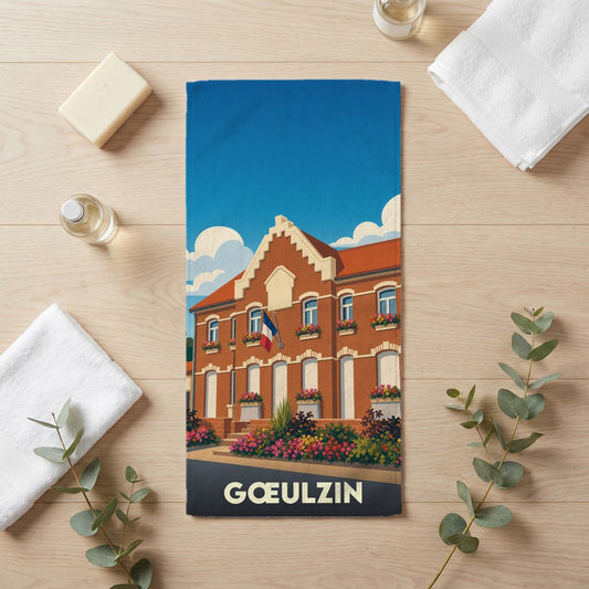 Serviette de bain souvenir de la ville de Gœulzin avec une illustration stylisée.