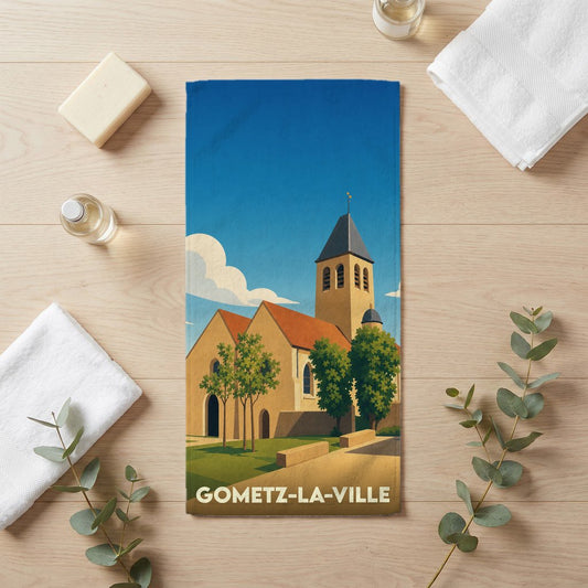 Serviette de bain souvenir de Gometz-la-Ville avec une illustration stylisée de son église.