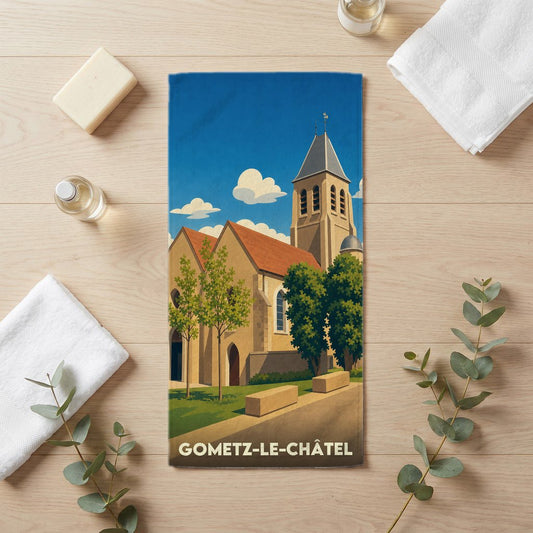 Serviette de bain souvenir de Gometz-le-Châtel avec une illustration stylisée de son église.