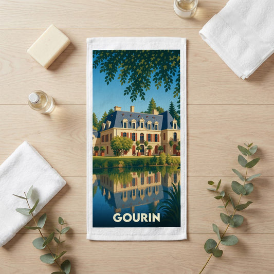Serviette de bain souvenir de la ville de Gourin avec une illustration stylisée d'un château se reflétant dans l'eau.