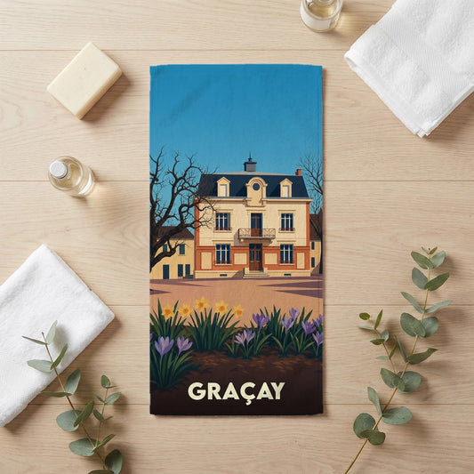 Serviette de bain souvenir de la ville de Graçay avec une illustration stylisée d'un bâtiment historique.