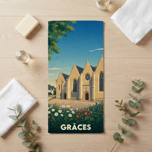 Serviette souvenir de la ville de Grâces avec une illustration stylisée d'une église et de fleurs.