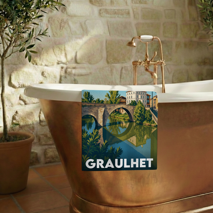 Serviette de bain souvenir de la ville de Graulhet avec une illustration stylisée.