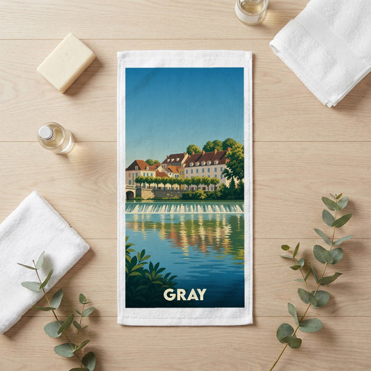 Serviette de bain souvenir de la ville de Gray avec une illustration stylisée d'un paysage urbain au bord de l'eau.