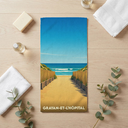 Serviette de bain souvenir de la ville de Grayan-et-l'Hôpital avec une illustration stylisée d'un chemin de plage.