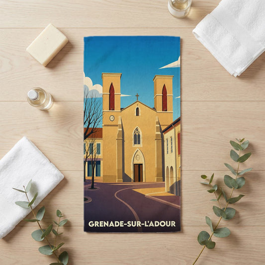 Serviette de bain souvenir de la ville de Grenade-sur-l'Adour avec une illustration stylisée de son église.