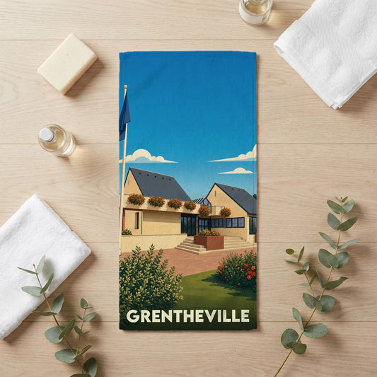 Serviette de bain souvenir de la ville de Grentheville avec une illustration stylisée de sa mairie.