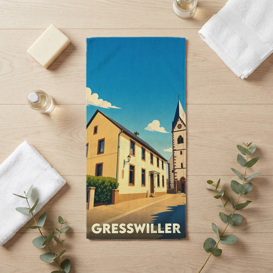 Serviette de bain souvenir de la ville de Gresswiller avec une illustration stylisée.