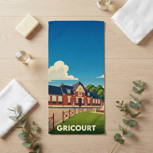 Serviette de bain souvenir de la ville de Gricourt avec une illustration stylisée d'un bâtiment traditionnel.