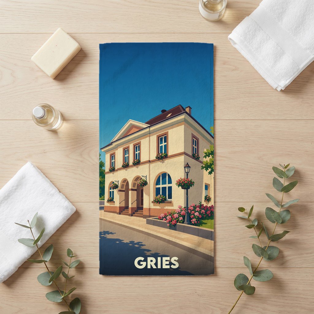 Serviette de bain souvenir de la ville de Gries avec une illustration stylisée d'un bâtiment traditionnel fleuri.