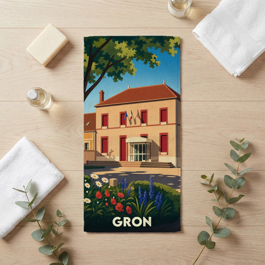 Serviette de bain souvenir de la ville de Gron avec une illustration stylisée d'un bâtiment officiel et d'un jardin fleuri.
