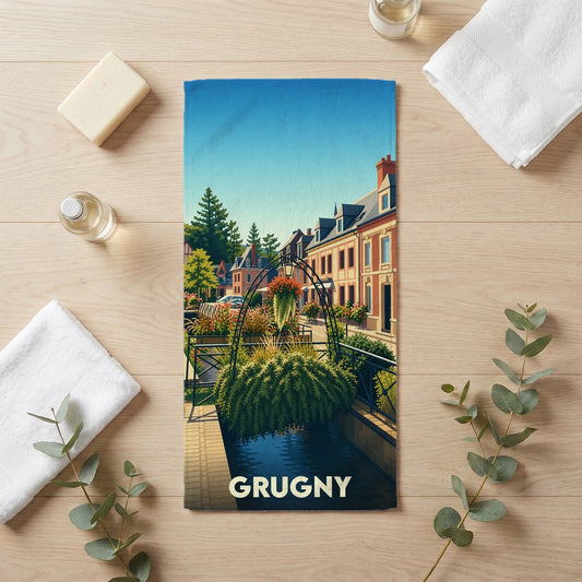 Serviette de bain souvenir de la ville de Grugny avec une illustration stylisée d'un paysage urbain fleuri.