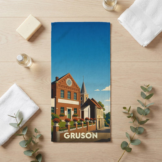 Serviette de bain souvenir de la ville de Gruson avec une illustration stylisée.