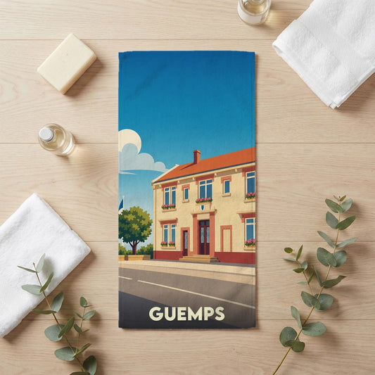 Serviette de bain souvenir de la ville de Guemps avec une illustration stylisée d'un bâtiment typique.