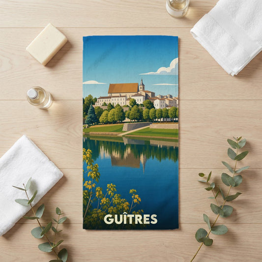 Serviette de bain souvenir de la ville de Guîtres avec une illustration stylisée.
