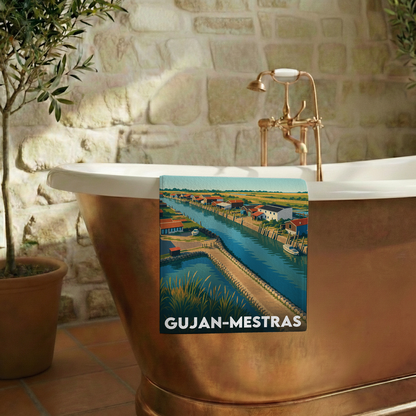 Serviette de bain souvenir de la ville de Gujan-Mestras avec une illustration stylisée.